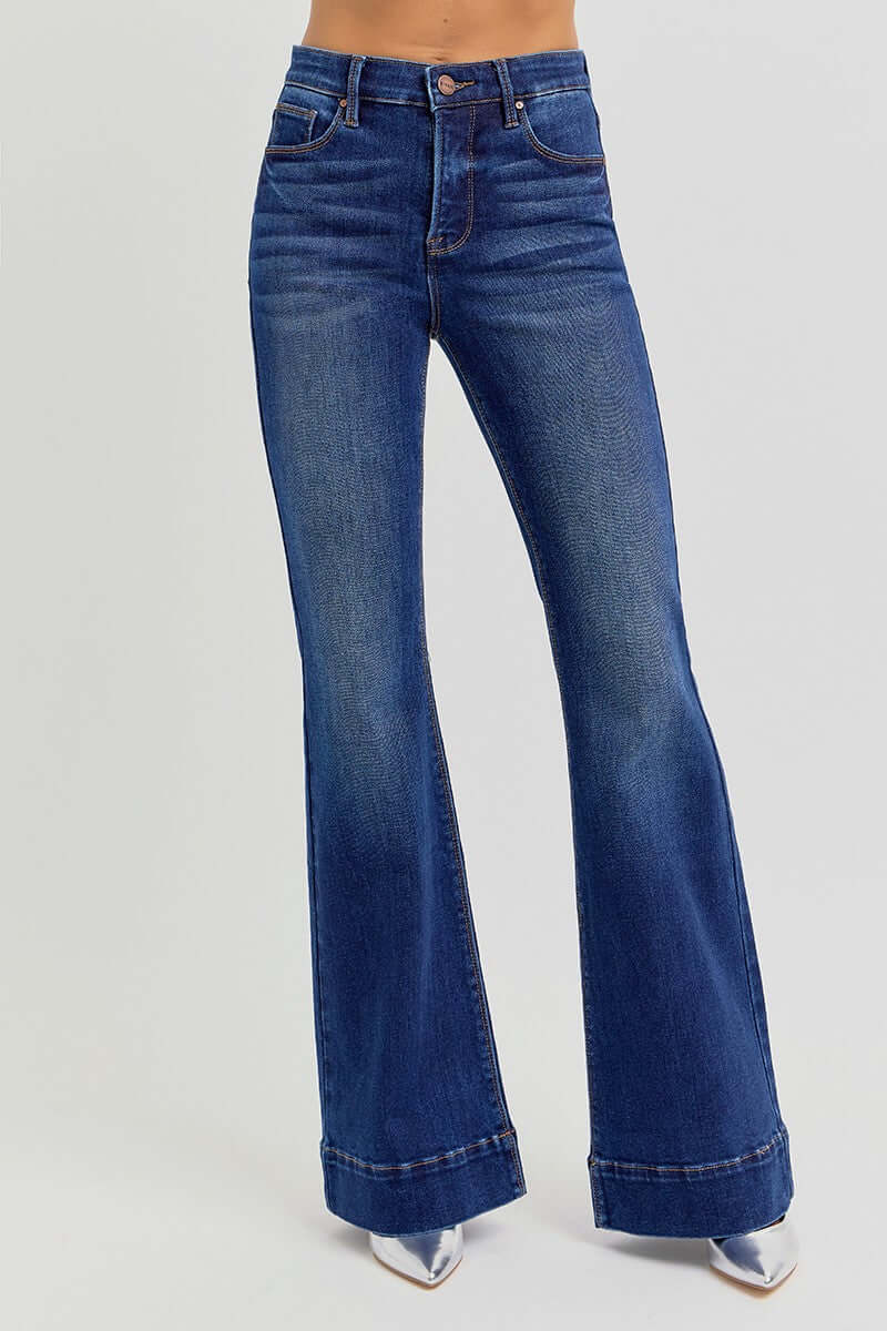 Risen Tummy Control High Rise Flare Jeans with elastic band, showcasing fit and flare leg style on a model.