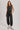 Washed black sleeveless jogger jumpsuit by blueivy featuring a relaxed fit, drawstring waist, and casual skirt style.