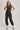 Washed black sleeveless jogger jumpsuit by blueivy, relaxed fit with drawstring waist, one-piece skirt with casual style.