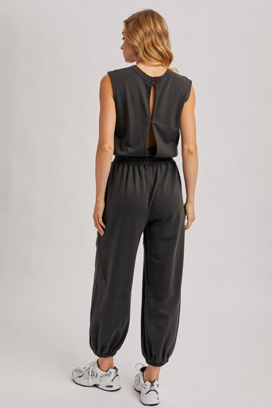 Washed black sleeveless jogger jumpsuit by blueivy featuring relaxed fit, drawstring waist, and casual skirt-style design.