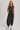 Blueivy Washed Black Sleeveless Jogger Jumpsuit with relaxed fit, drawstring waist, and skirt-style design, shown in the product image.