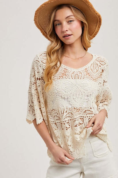 Ivory crochet lace top by Blueivy, featuring intricate lace detailing and a delicate, feminine design for stylish wear.
