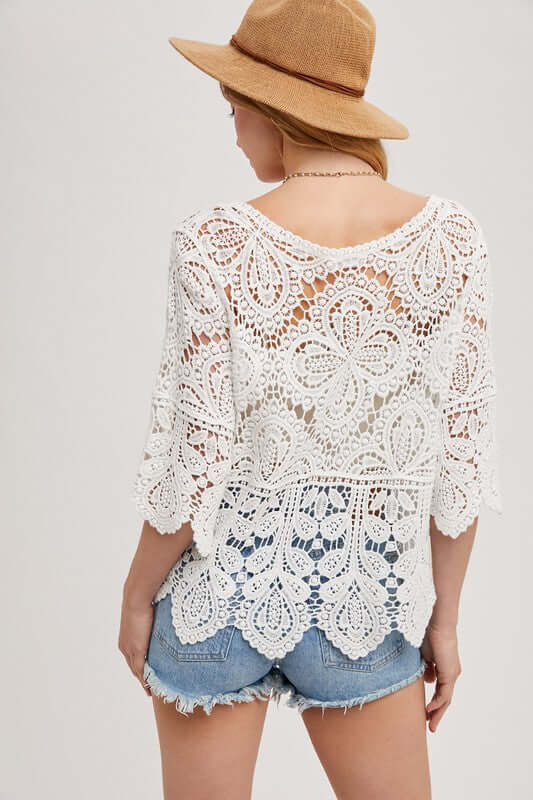 Ivory crochet lace top by BlueIvy, detailed close-up showing intricate lace pattern and lightweight, elegant fabric.