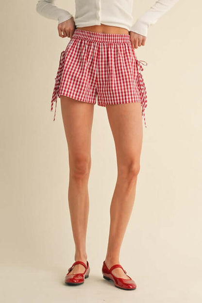 Gingham check shorts by anniewear with side bow detail, featuring a casual and stylish summer bottom.