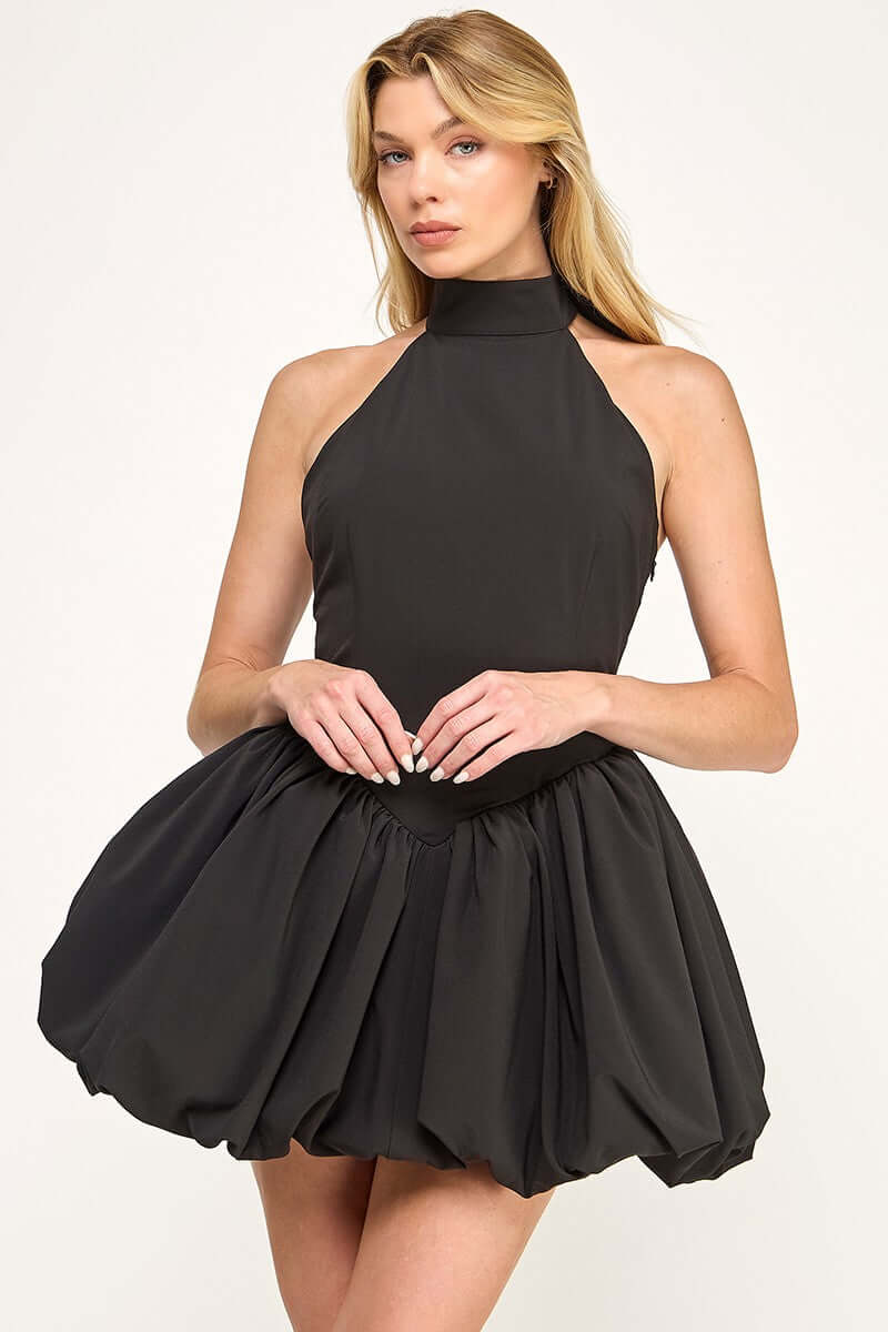 Black satin bubble mini dress from The Vintage Shop, featuring a fitted bodice and short puffed sleeves.