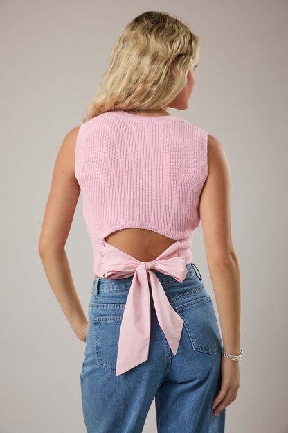 LE LIS sleeveless sweater top with back bow detail, lightweight knit, high neckline, and fitted style perfect for layering.