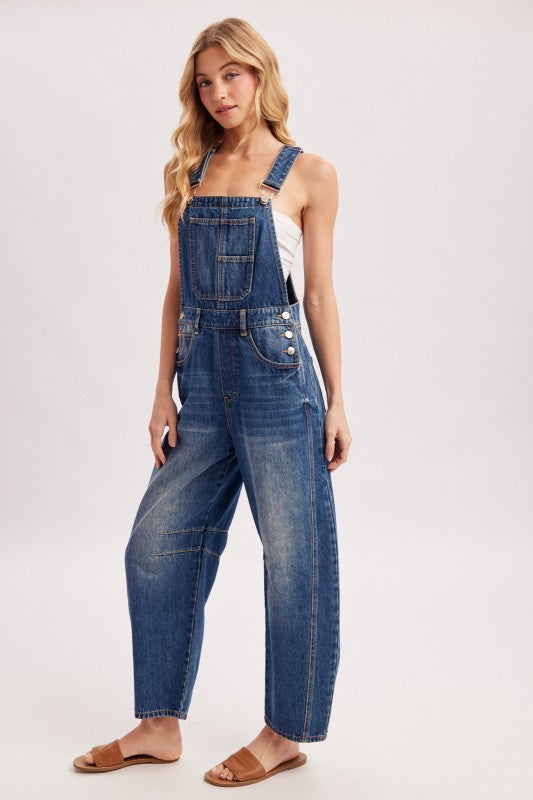 Women’s blue denim barrel overalls with wide-leg bib design, relaxed fit, and adjustable shoulder straps from blueivy.