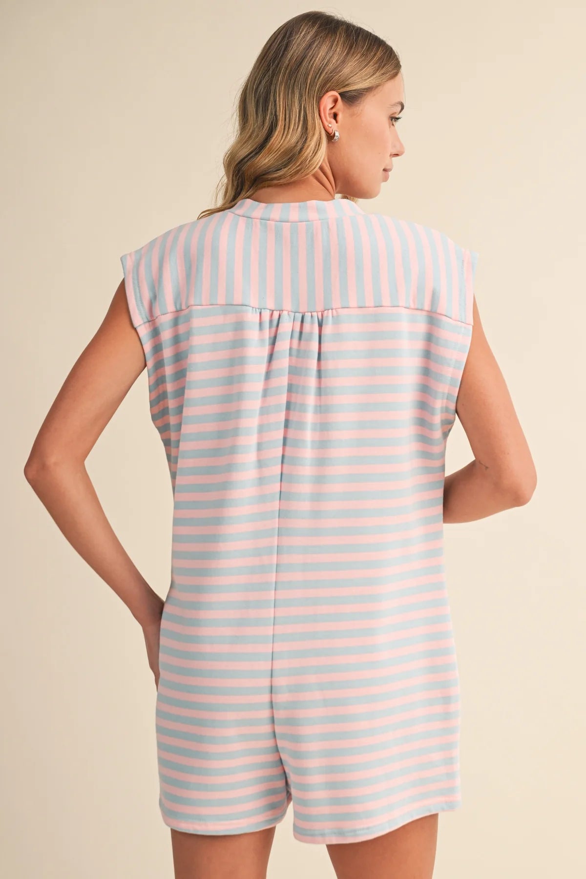 Klesis short sleeve striped button-down romper with vertical blue and white stripes, casual and stylish jumpsuit for warm weather.