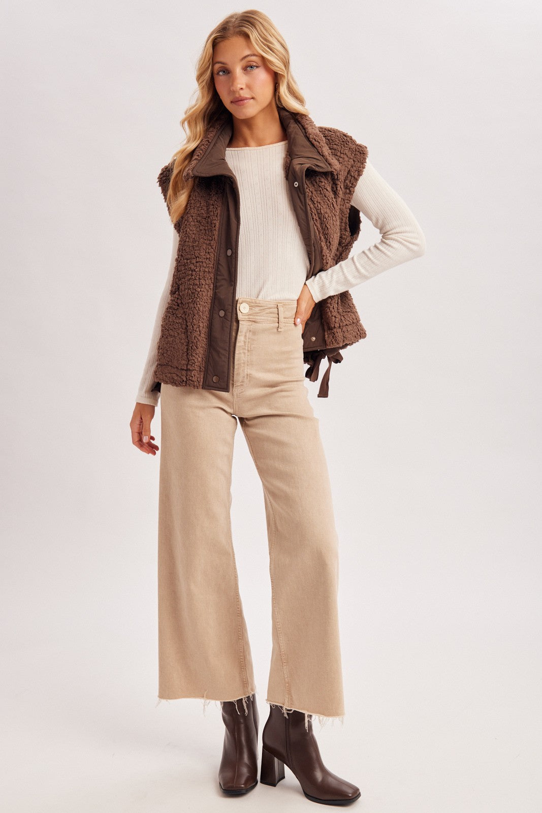 Blueivy women’s Sherpa button-down vest from Cowgirl Charm, a cozy short sleeve sweater with plush sherpa material.