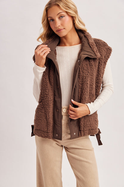 Blueivy women’s sherpa button-down vest from Cowgirl Charm, short sleeve sweater with cozy fleece lining and stylish button details.