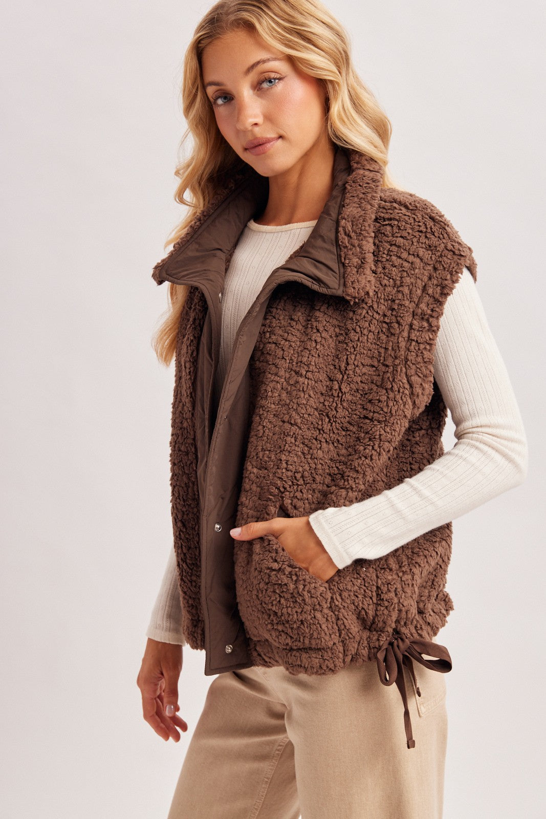 Women’s Sherpa button-down vest by blueivy, cozy short sleeve sweater with a sherpa-lined front and button closure.