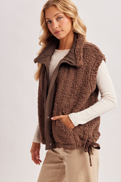Women’s Sherpa button-down vest by blueivy, cozy short sleeve sweater with a sherpa-lined front and button closure.