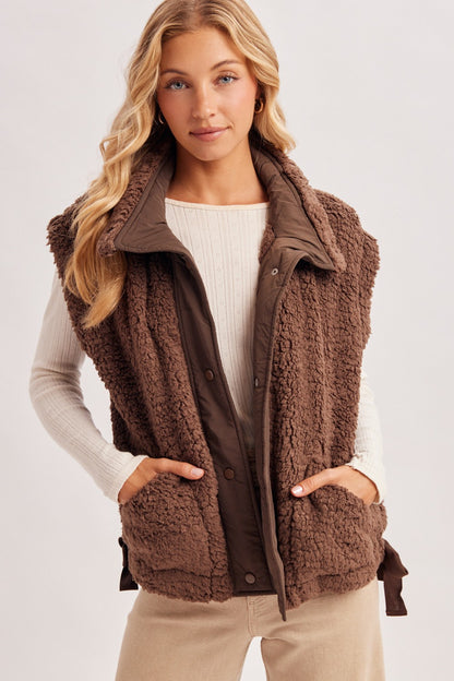 Blueivy women’s sherpa button-down vest from Cowgirl Charm, short sleeve sweater with cozy sherpa fabric and button front detail.