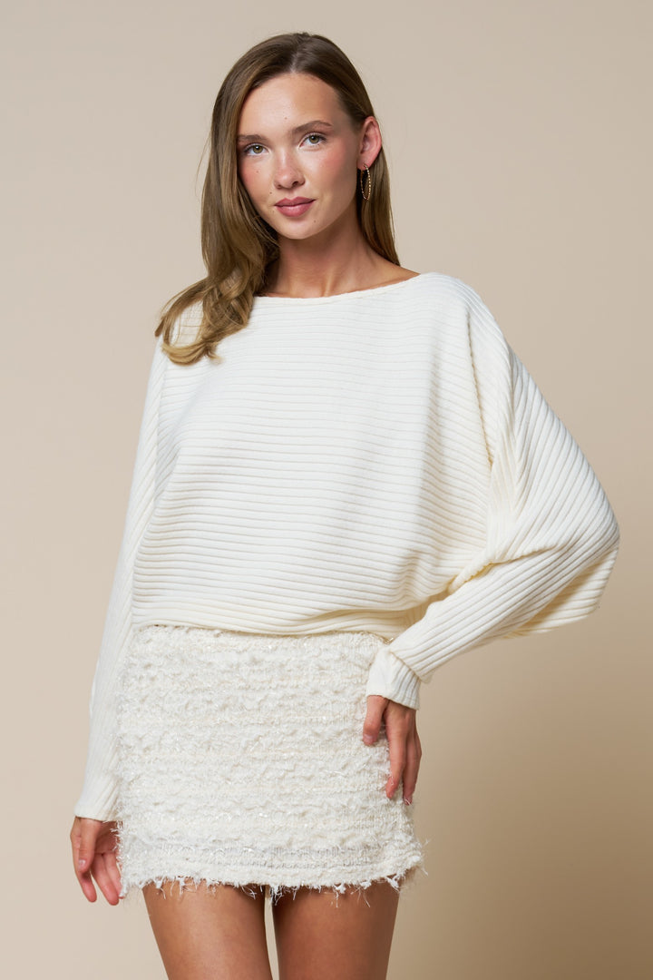 Ivory ribbed dolman sleeve boat neck sweater by Blue Blush, showcasing soft knit fabric and relaxed fit.