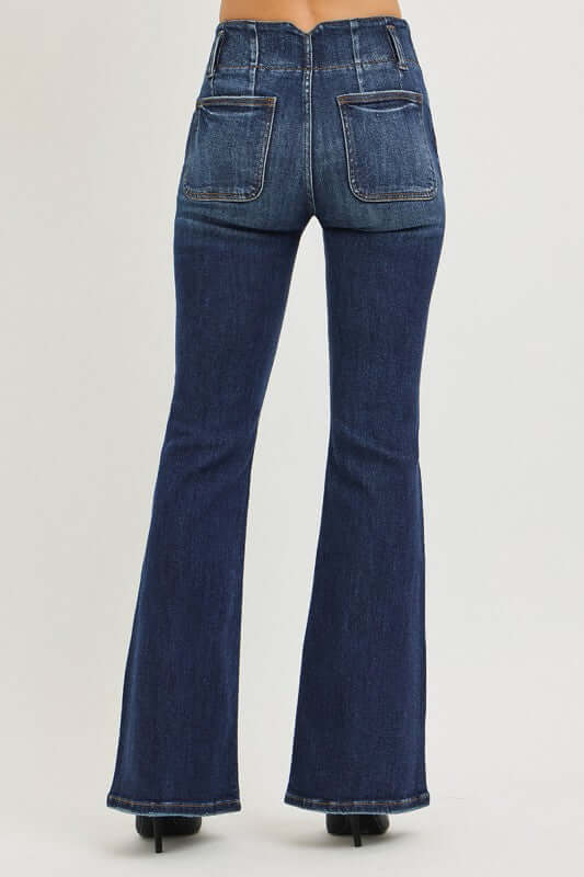 Risen high rise flare jeans with seam detail waistband, showing the fit and style of the denim bottoms.