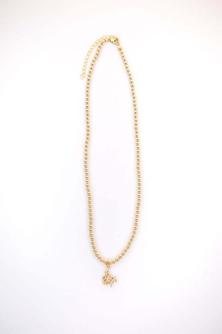 16-inch 18K white gold plated burnished necklace with bucking horse charm from West & Co. on a neutral background.