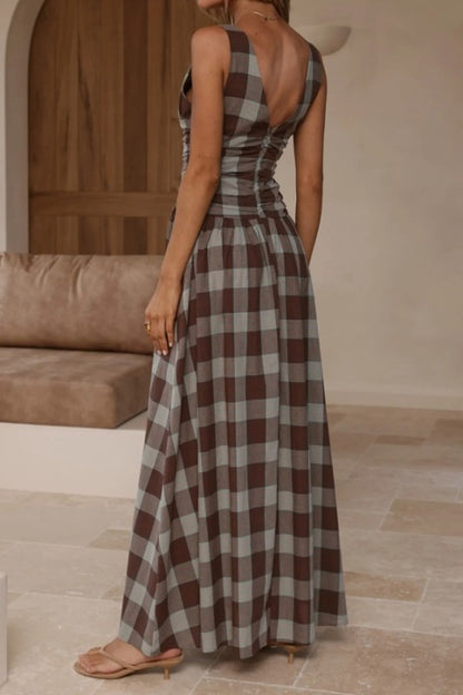 Brown plaid maxi dress with ruched bodice by Sunday Up, featuring a flowing silhouette and stylish plaid pattern.