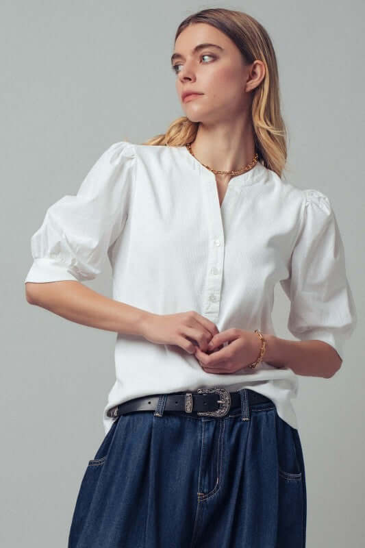 Soft pink puff sleeve blouse from trend:notes featuring delicate fabric and feminine design, perfect for casual or dressy wear.