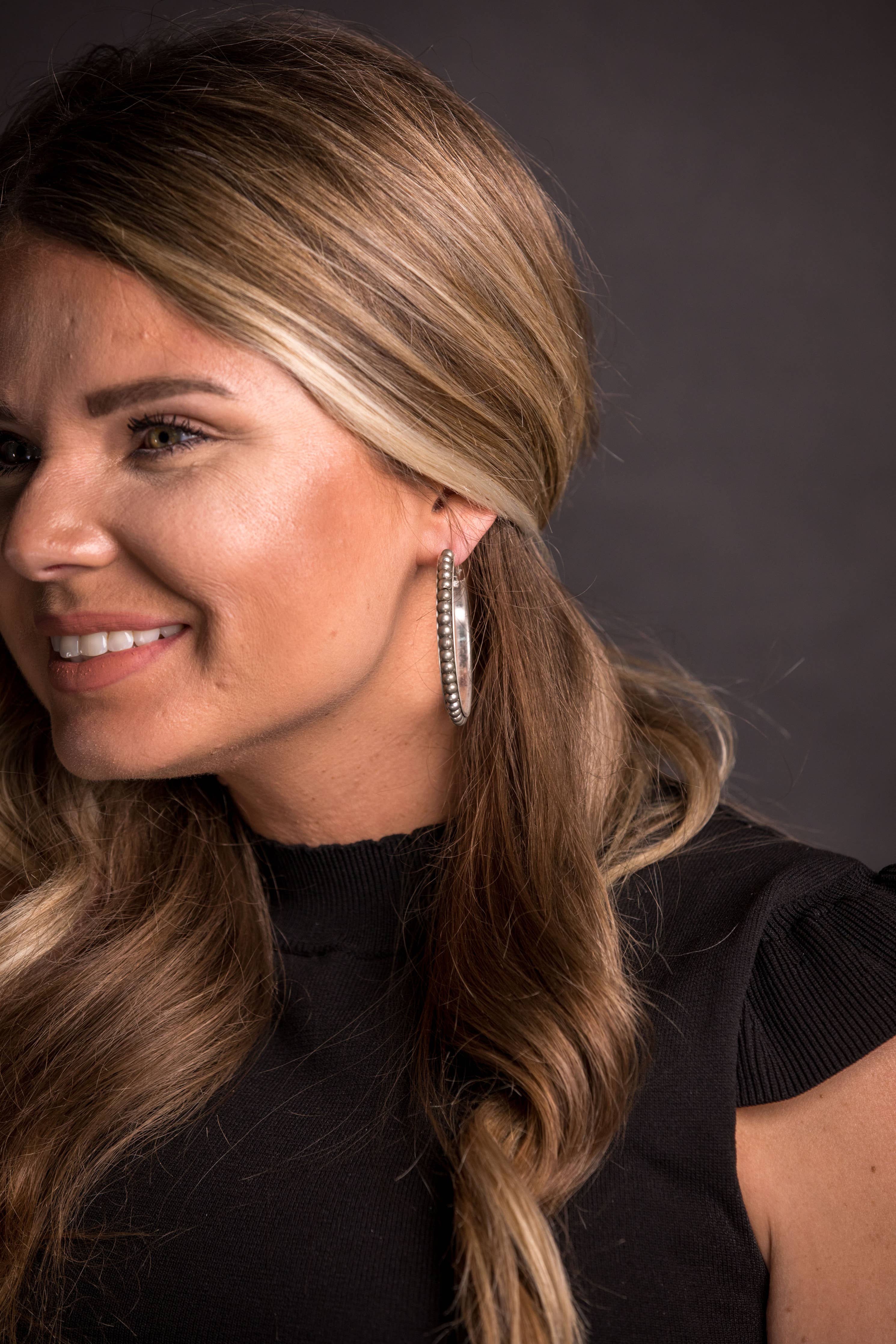 Worn Silver Trimmed Hoop Earring