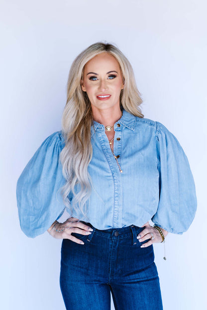 Blueivy denim button-down puff sleeve shirt shown on a hanger, featuring a classic collar and stylish puffy sleeves.