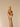 KITSCH Caramel Cream Hair and Body Perfume Mist bottle with a light caramel-colored liquid inside.