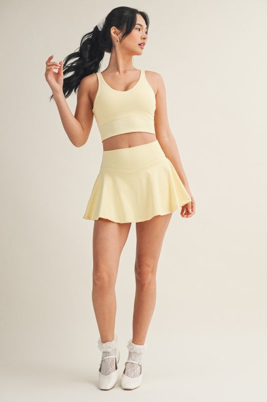 Kimberly C mini circle skort with bow back detail, stylish bottoms with flared design and back bow accents.