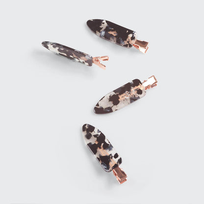Set of four black terrazzo creaseless clips by KITSCH for securing hair, featuring eco-friendly design and durable plastic material.