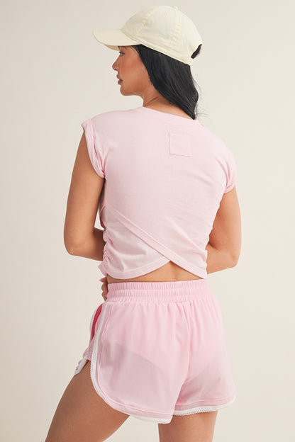 Kimberly C crossover top featuring stylish blouse design with long sleeves and a modern fit, perfect for casual or office wear.