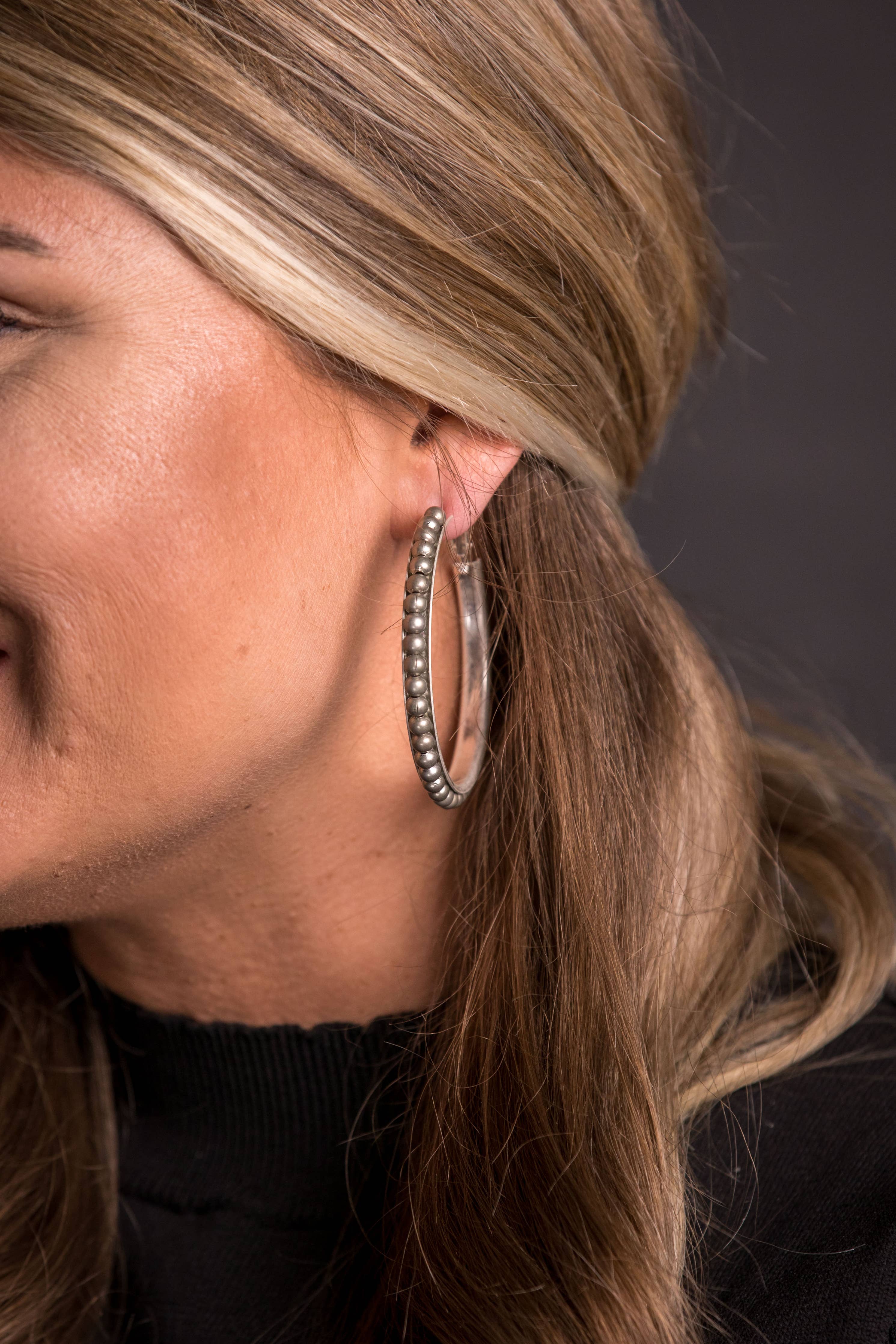 Worn Silver Trimmed Hoop Earring