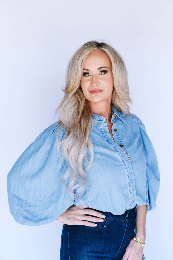 Blueivy denim button-down shirt with puff sleeves, featuring a classic collar and front buttons, displayed on a neutral background.