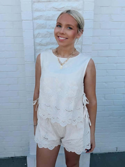 Linen embroidered two-piece set by Day + Moon with intricate floral embroidery on lightweight fabric, perfect for casual wear.
