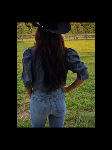 Women’s chambray puff sleeve button-up blouse by Vine and Love, Western denim top with stylish puff sleeves and button front.