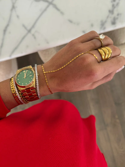 Chansuttpearls GLAM hand chain jewelry featuring pearl accents and delicate metal links, styled on a model's hand.