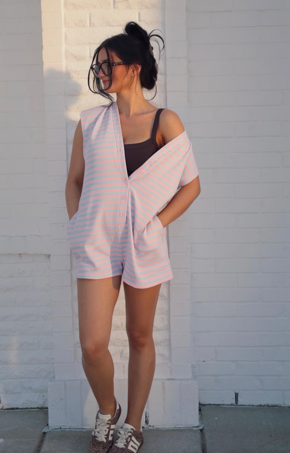 Klesis short sleeve striped button-down romper with a relaxed fit, featuring a casual, stylish design for warm weather.