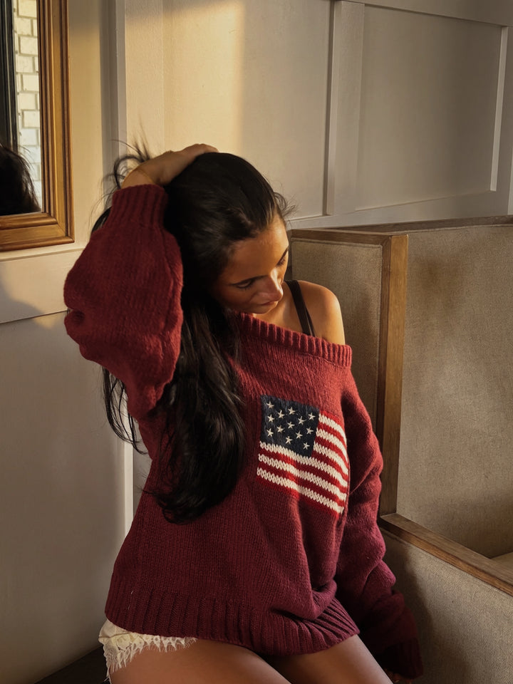 TICTOC Brandi ribbed knit sweater with American flag design, featuring long sleeves and cozy knit fabric.
