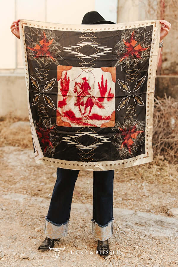 Lucky & Blessed black Aztec cowboy wild rag with colorful stitch and printed design, perfect as a stylish accessory.