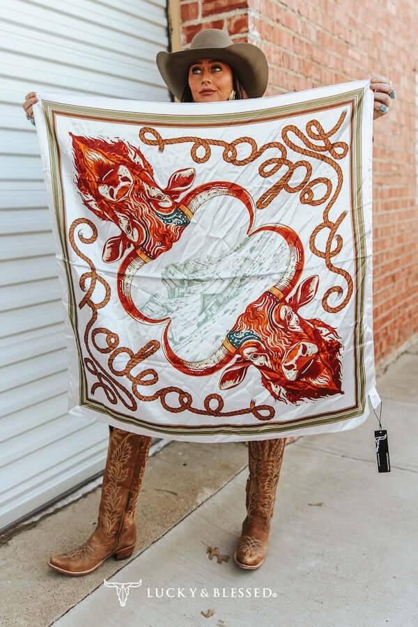 Lucky & Blessed cream buffalo rodeo printed wild rag featuring bold western rodeo patterns and soft fabric.