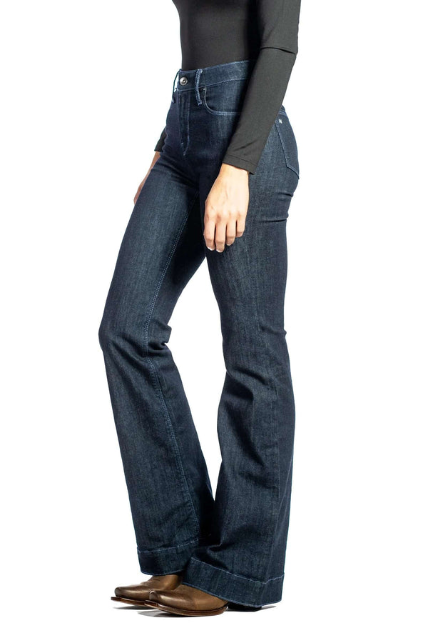 Haala Denim Bella flare trousers in midnight blue with dusk blue stitching, showing the stylish high-waist fit and flared leg design.