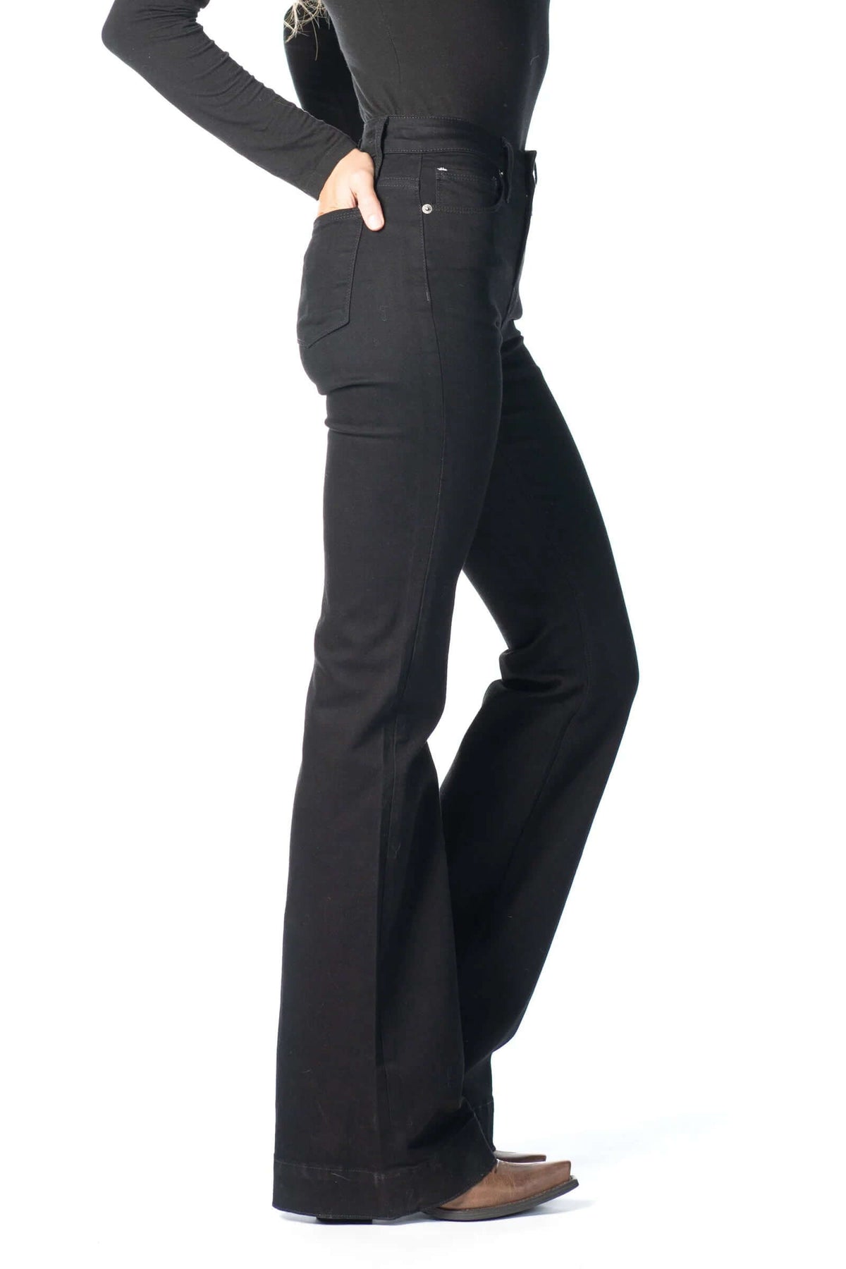 Haala Denim Bella flare trousers in black with contrast black stitching, showcased on a model against a neutral background.