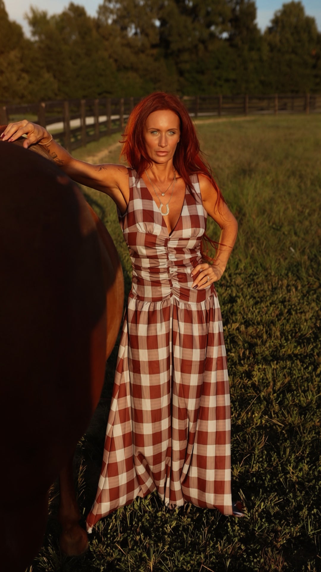 Brown plaid ruched bodice maxi dress by Sunday Up, featuring a flowing skirt and fitted bodice, styled for casual or formal occasions.