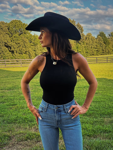 Black and white double-lined high neck bodysuit by HYFVE, featuring a sleek, fitted design and stylish high neckline.