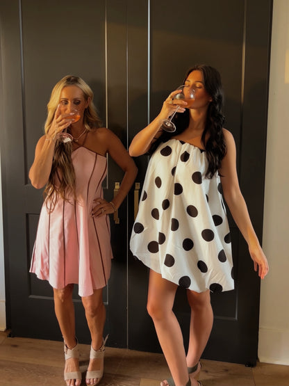 Polka dot off-shoulder strapless tube mini balloon dress by Day + Moon, featuring a playful design and fitted silhouette.