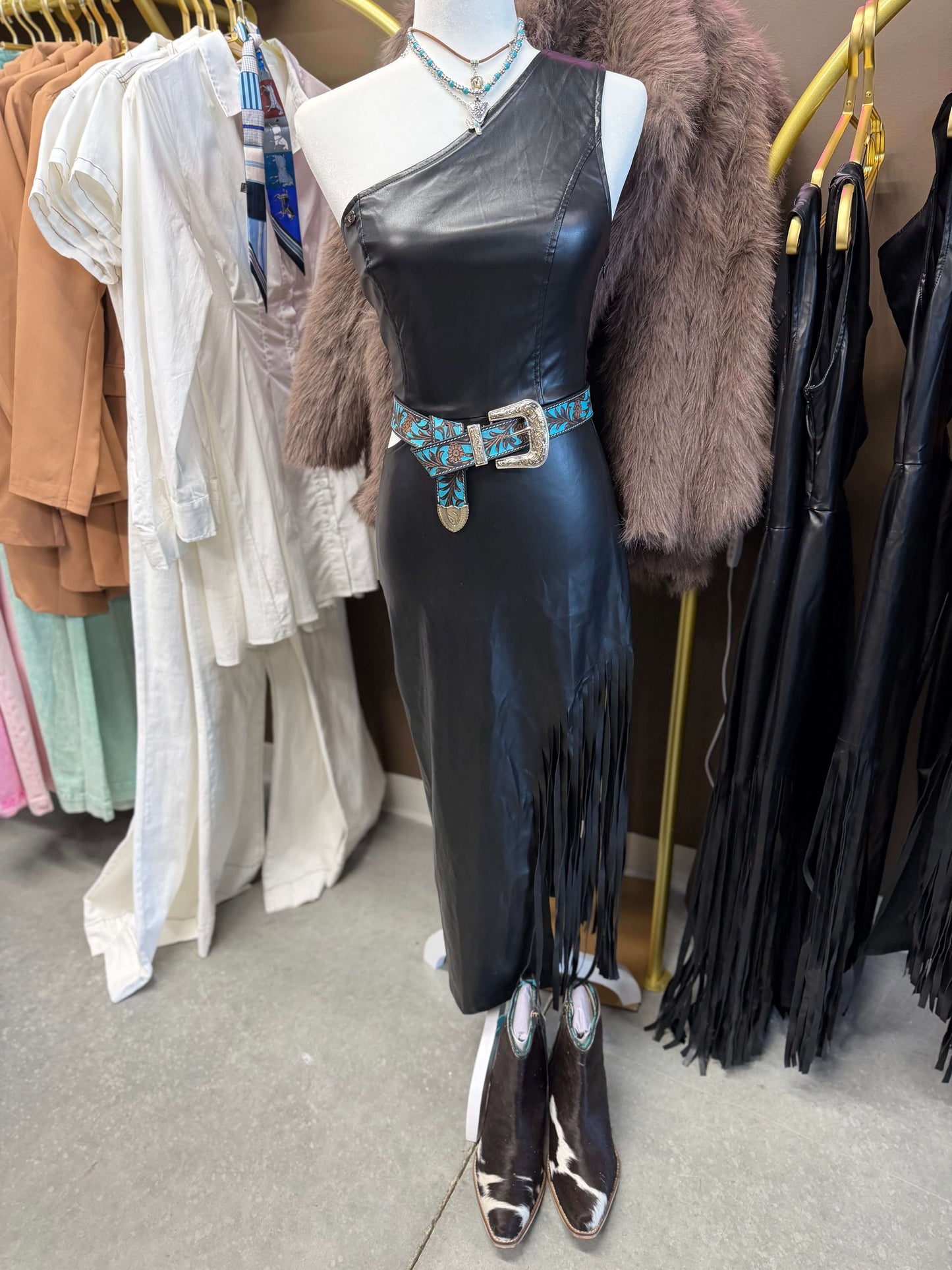 Black faux leather dress with side fringe, cut-out waist and sleeveless design by Lucky & Blessed.