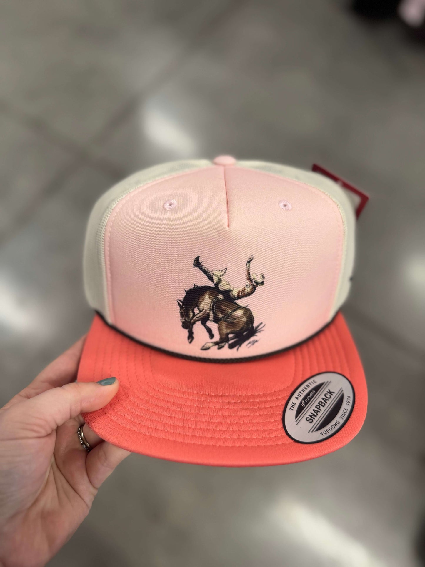 Kimes Ranch Winning Ride snapback hat showing front view with embroidered logo and adjustable strap in a stylish accessories image.