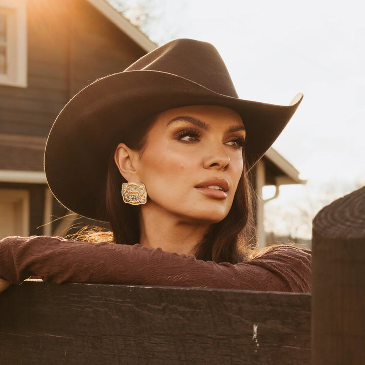 Gold Hillbetty Rodeo Earrings with detailed cowboy hat and rope design, perfect for Western-inspired jewelry style.