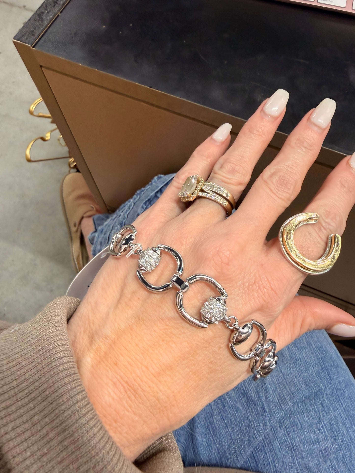 Silver and diamond accented Cowgirl Charm bracelet with bit details, stylish jewelry accessory for Western-inspired fashion.