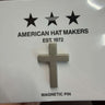 Silver cross magnetic pin on a 'American Hat Makers' branded card