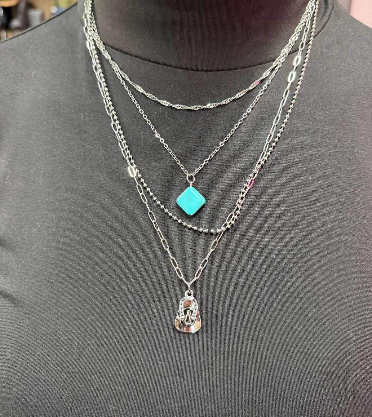 Gold plated layered chain necklace with turquoise accents, available in 14, 15, 18, and 20-inch lengths by West & Co.