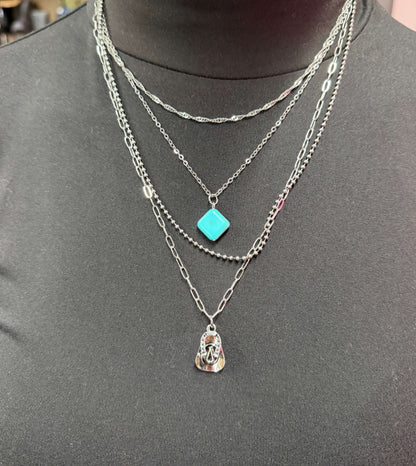 Gold plated layered chain necklace with turquoise accents, available in 14, 15, 18, and 20-inch lengths by West & Co.
