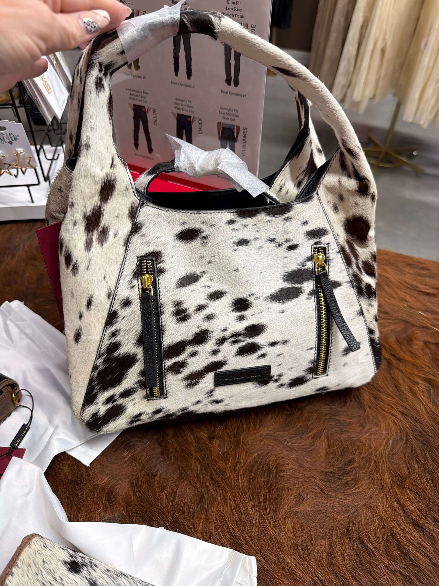Loyal West Vita Servans Hobo Bag with cowgirl charm and concealed carry design, featuring leather straps and spacious interior.